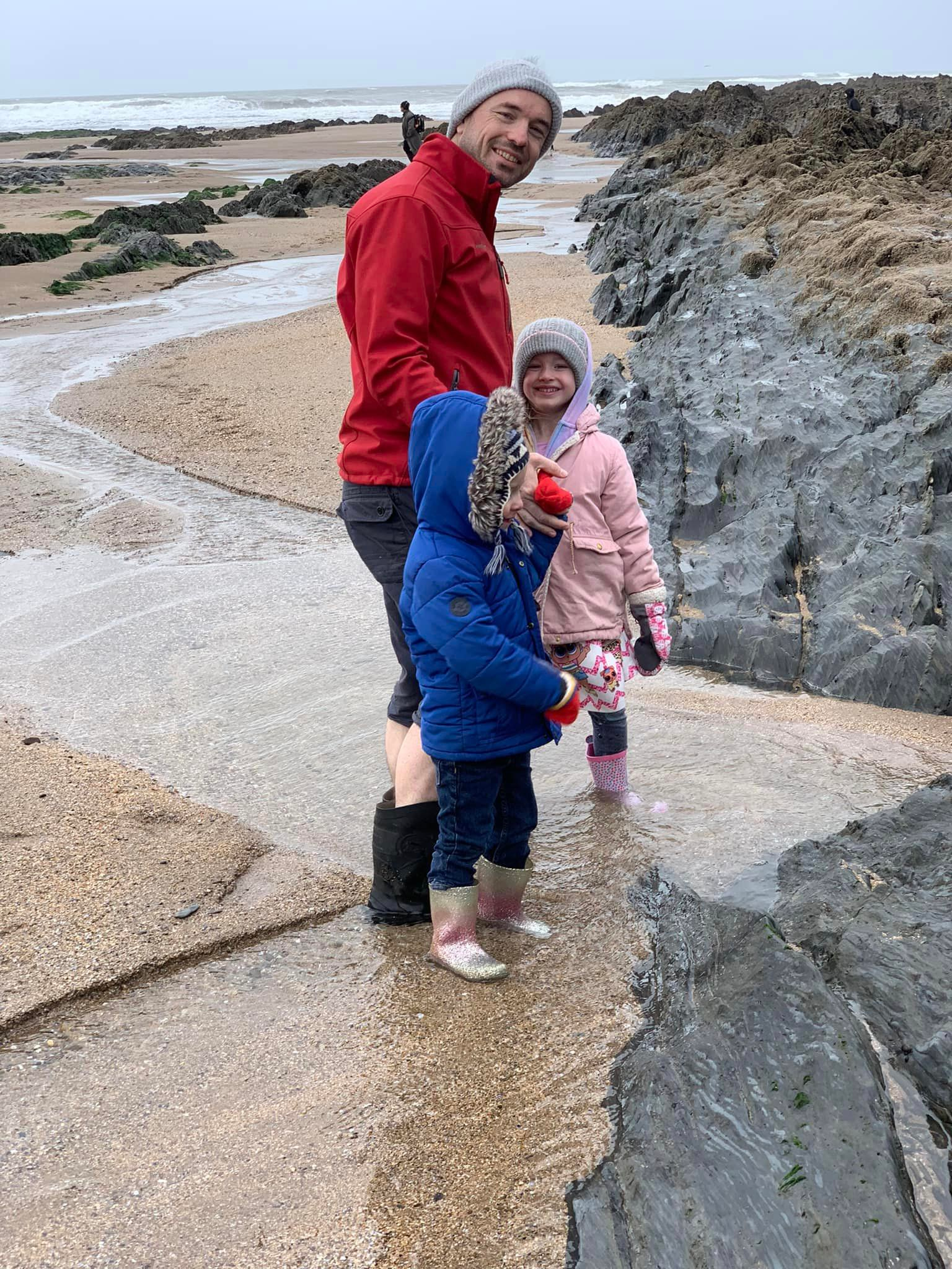 Joe Reddington and children on the beach